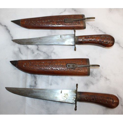 163 - 2 x Decorative Carved Wood Indian Daggers In Sheaths 
COLLECTION ONLY
OVER 18 ID WILL NEED TO BE PRO... 