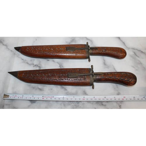 163 - 2 x Decorative Carved Wood Indian Daggers In Sheaths 
COLLECTION ONLY
OVER 18 ID WILL NEED TO BE PRO... 