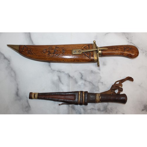 165 - Carved Decorative Wooden Indian Dagger And Smaller Dagger In Leather Sheath
COLLECTION ONLY
OVER 18'... 