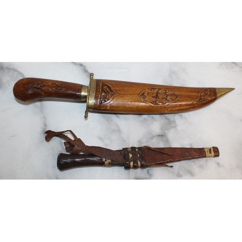 165 - Carved Decorative Wooden Indian Dagger And Smaller Dagger In Leather Sheath
COLLECTION ONLY
OVER 18'... 