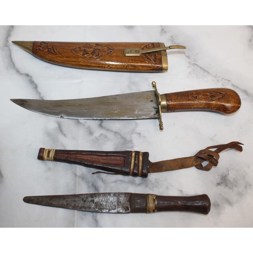 165 - Carved Decorative Wooden Indian Dagger And Smaller Dagger In Leather Sheath
COLLECTION ONLY
OVER 18'... 