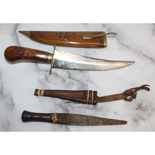 165 - Carved Decorative Wooden Indian Dagger And Smaller Dagger In Leather Sheath
COLLECTION ONLY
OVER 18'... 