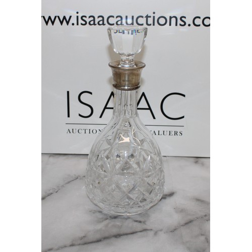 607 - A Collectable Glass Decanter With A Silver Hall Marked Top H:28cm
COLLECTION ONLY