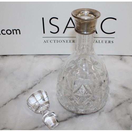 607 - A Collectable Glass Decanter With A Silver Hall Marked Top H:28cm
COLLECTION ONLY