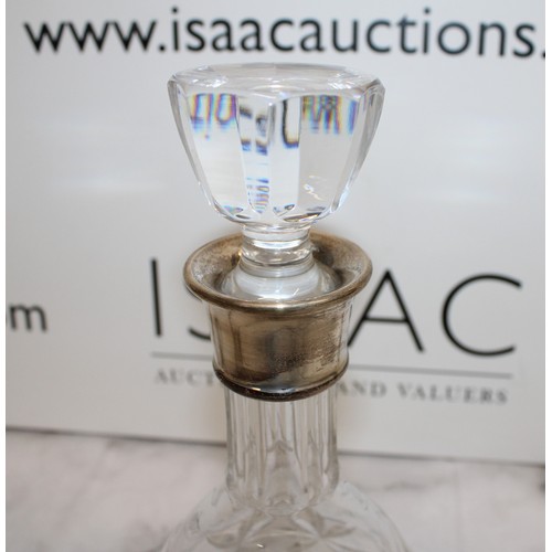 607 - A Collectable Glass Decanter With A Silver Hall Marked Top H:28cm
COLLECTION ONLY