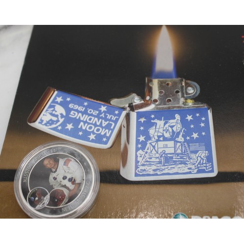 19 - A Sealed Collectable Zippo Magazine And Lighter Commemorating The 1969 Moon Landing