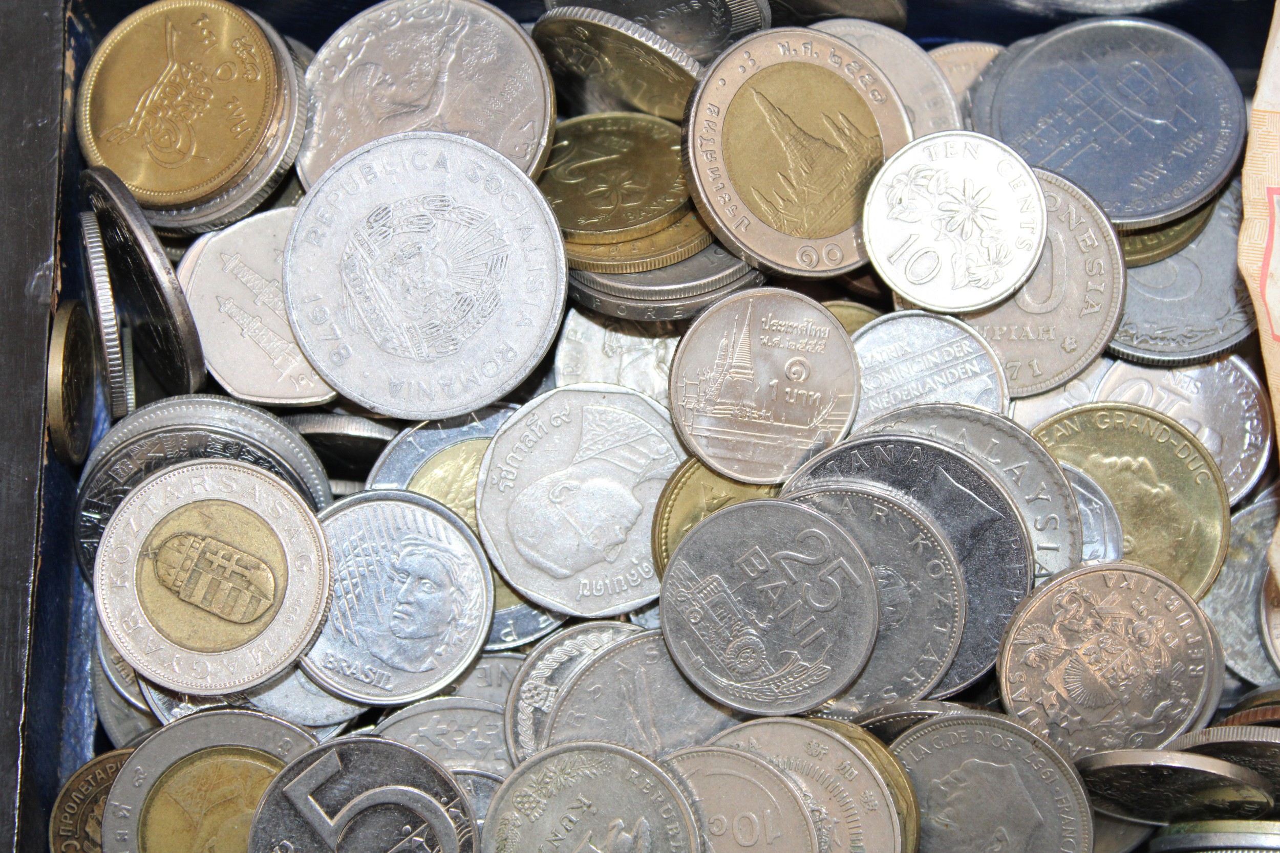 A Decorative Wooden Box Containing Worldwide Coins And Note