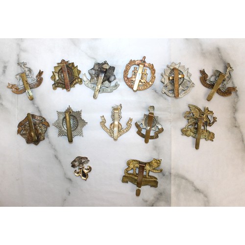 226 - A Selection Of Military Cap Badges - As Found
