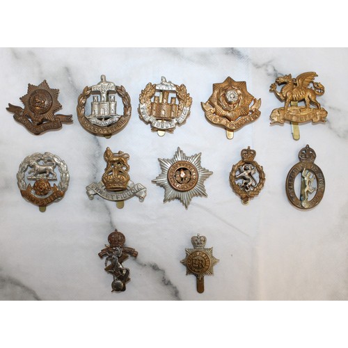 235 - A Selection Of Military Cap Badges - As Found