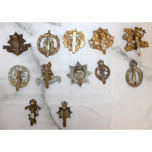 235 - A Selection Of Military Cap Badges - As Found