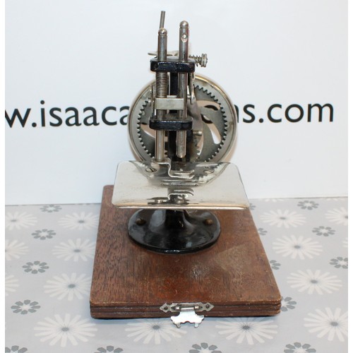 106 - Wooden Cased Lead Miniature Toy Sewing Machine A Japanese 