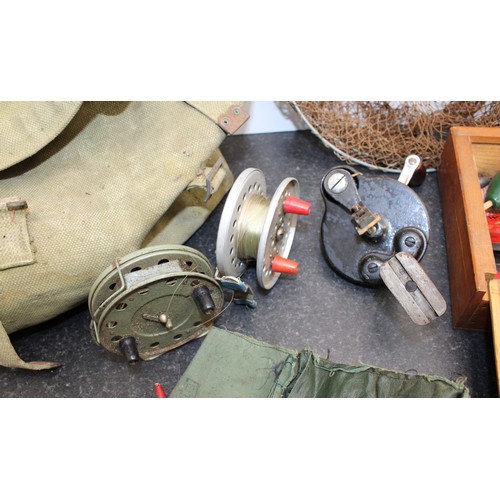 235 - A Selection Of Fishing Items Including: Floats/Line And Reels Etc Inside A British Army Canvas Bag A... 