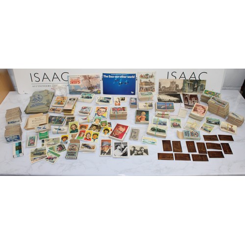 244 - A Quantity Of Cigarette Cards, Postcards Etc As Found
