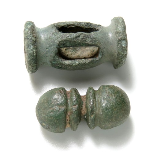 5 - Late Iron age to Roman bronze toggles, one a balauster type with slots for attachment, the other a d... 