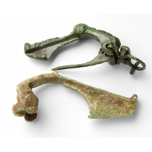 33 - Two roman bronze brooches. Circa, 1st-2nd century AD. Copper-alloy, Largest 50mm. Ref: Richard Hatta... 