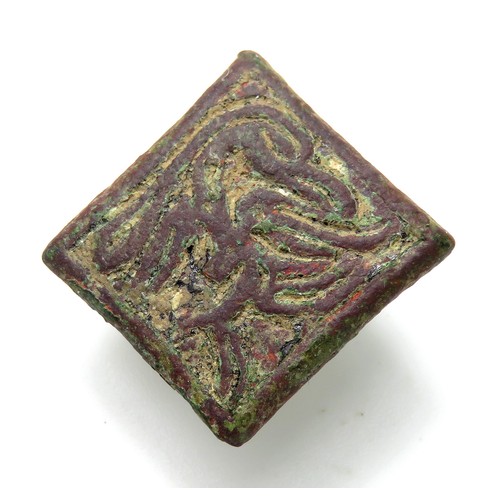 60 - Medieval bronze heraldic mount circa 13th century. A lozenge-shaped bronze mount depicting a bird of... 