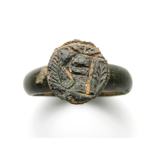 77 - Medieval bronze seal ring, the circular bezel engraved with a crowned letter R. 26mm diameter x 30mm... 