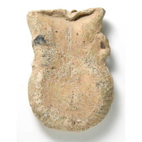 91 - Medieval pilgrims ampulla. Circa, 14th century AD. Lead, 50mm x 32mm, 44.1g. A purse type ampulla de... 