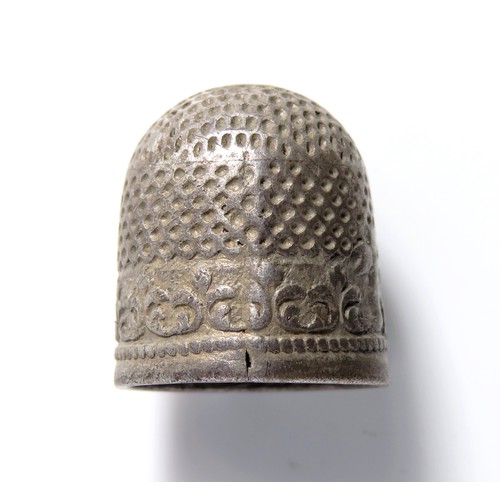 129 - Silver thimble. Circa, 17th-18th century AD. Silver, 5.5 grams. 18mm x 15mm. A short two piece thimb... 