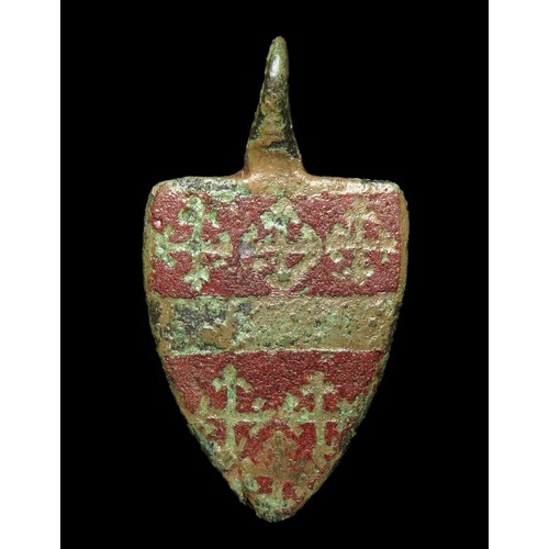 72 - Medieval heraldic pendant. Circa 13th century AD. Copper-alloy, 49mm x 26mm, 11.9g. A shield-shaped ... 