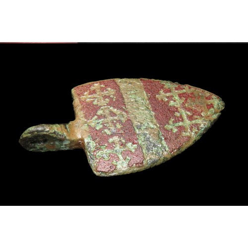 72 - Medieval heraldic pendant. Circa 13th century AD. Copper-alloy, 49mm x 26mm, 11.9g. A shield-shaped ... 