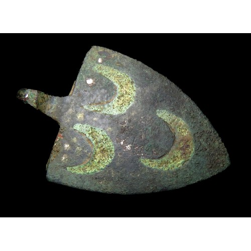 73 - Medieval heraldic pendant. Circa 13th century AD. Copper-alloy, 39mm x 26mm, 15.3g. A gilded shield-... 