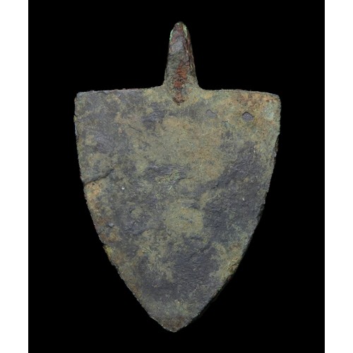 73 - Medieval heraldic pendant. Circa 13th century AD. Copper-alloy, 39mm x 26mm, 15.3g. A gilded shield-... 