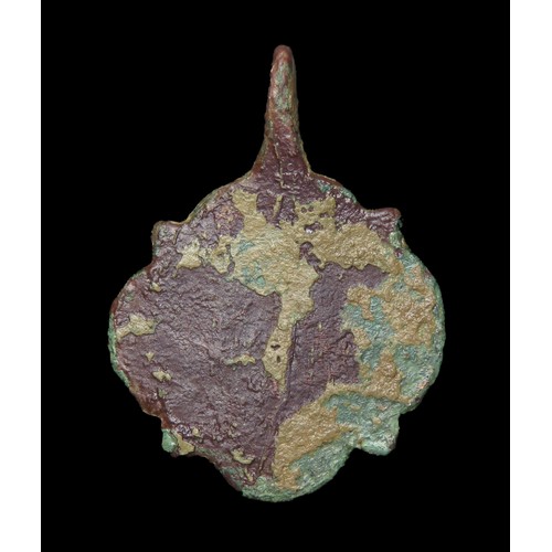 74 - Medieval harness pendant. Circa 14th century AD. Copper-alloy, 40mm x 31mm, 11.2g. A quatrefoil-shap... 