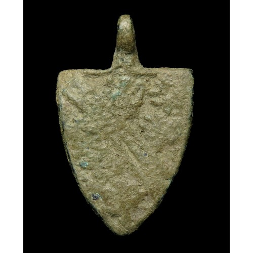 75 - Medieval heraldic pendant. Circa, 13th-14th century AD. Copper-alloy, 42mm x 27mm, 12.6g. A shield-s... 