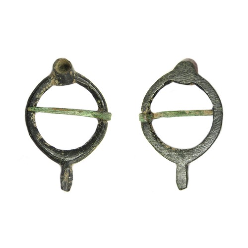 84 - Medieval annular brooch. Circa 13th-14th century AD. Copper-alloy, 2.44g. 30.63 mm. A stylised form ... 