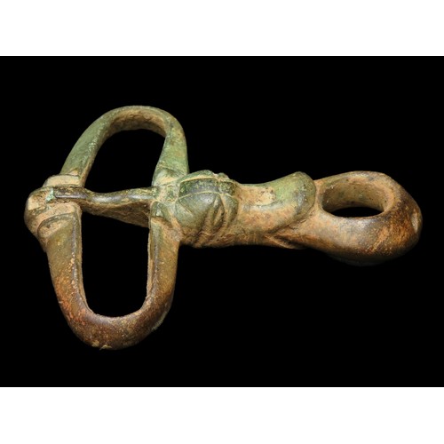 90 - Norman zoomorphic hunting leash buckle. Circa 12th century AD. Copper-alloy, 45mm x 37mm, 14.7g. The... 