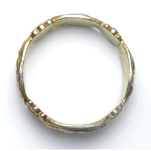 101 - Medieval silver-gilt Iconographic ring. Circa 14th-15th century AD. 25mm diameter (21mm internal), 6... 