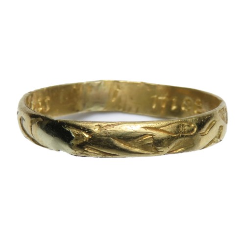 104 - Gold posey ring. Circa 18th century AD. 16mm x 3mm. 1.51 grams. Decorated on the outside of the band... 