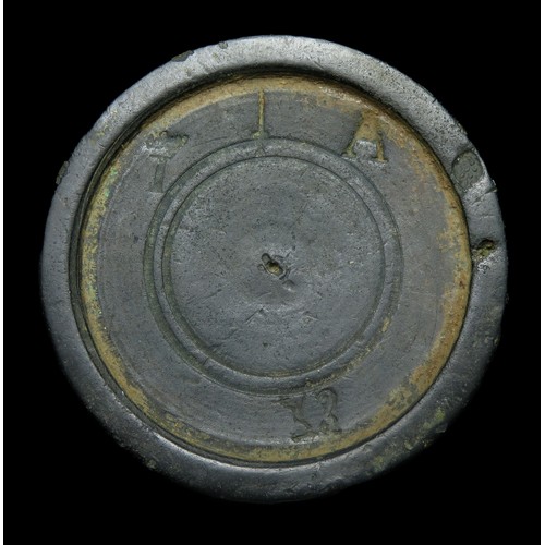 114 - James II bronze trade weight. 55mm diameter x 6mm, 107.4g. Marked with a crowned I, A, sword and ewe... 