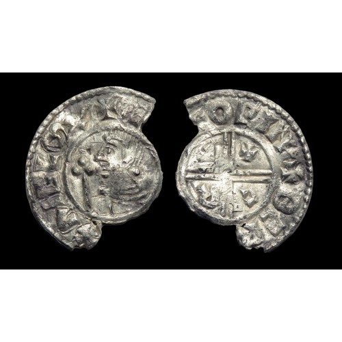 195 - Aethelred II penny, Crux type. Silver, 20mm, 1.04g. Obv: bare headed bust left, in front trefoil tip... 