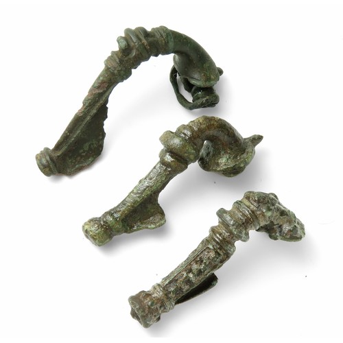 40 - Three Roman bronze trumpet brooches, 1st - 2nd century AD. Largest 60mm.