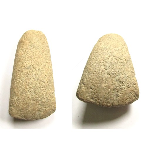 1002 - Neolithic polished stone axehead. Circa 3500 BC-2100 BC. 370.0g. 145.69 x 54.90 mm. In plan, the sid... 