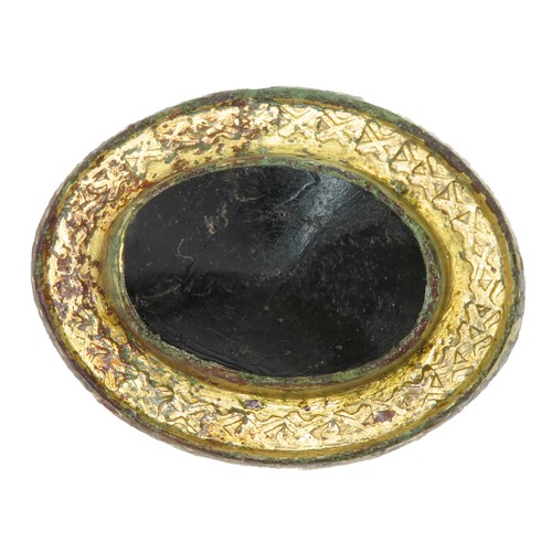 1018 - Roman glass centre boss brooch. Circa 3rd-4th century AD. Copper-alloy, 25mm, 8.5g. A gilded  oval b... 