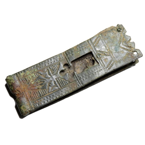 1061 - Medieval buckle plate. Circa 14th century AD. Copper-alloy, 14.75g. 61.15 mm. A long strap plate det... 