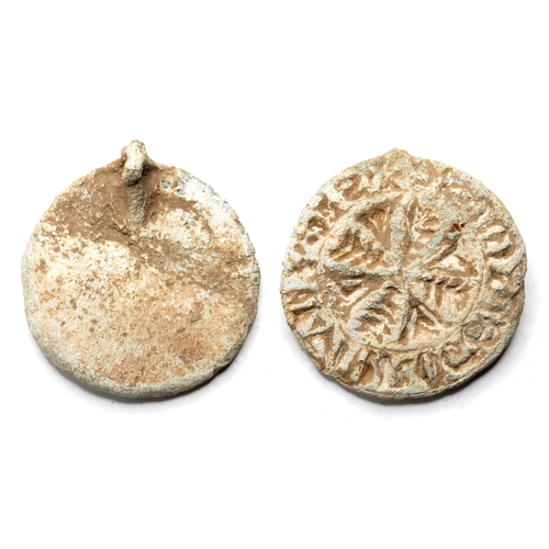 1062 - Medieval Seal Matrix. Circa 13th century AD. Lead, 26.40g. 35.10 mm. A round seal detailed with a ce... 