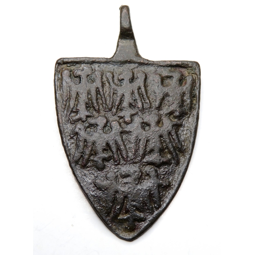 1064 - Medieval heraldic harness pendant. Circa 13th century AD. Copper-alloy, 11.59g. 42.99 mm. A shield-s... 