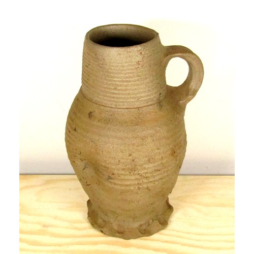 1075 - English Medieval Pottery Jug. Circa, 13th-14th century AD. 210 x 82 mm. A tall baluster type jug wit... 