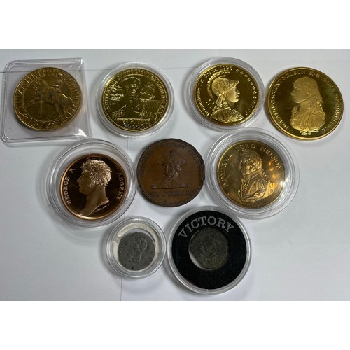 1350 - A selection of Modern commemorative five pound coins and medals relating to Nelson and the battle of... 