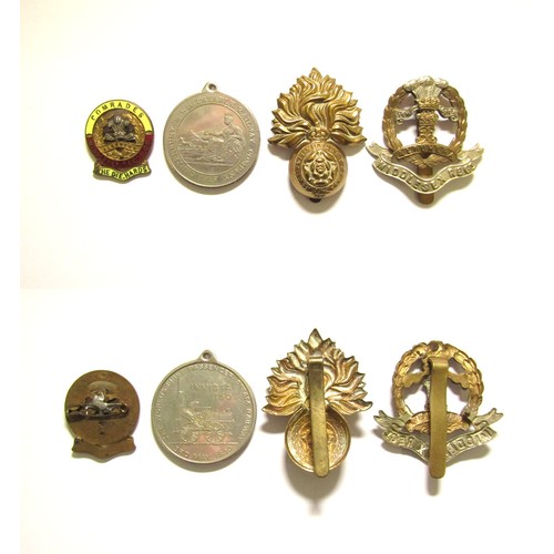 1351 - Collection of military badges and railway medal. An interesting group comprising an enamel badge and... 