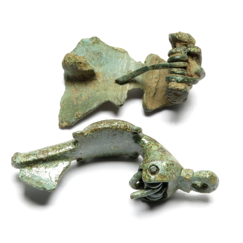 1037 - Roman brooch pair. An aesica type brooch and a trumpet-headed disc-on-bow brooch decorated with oran... 