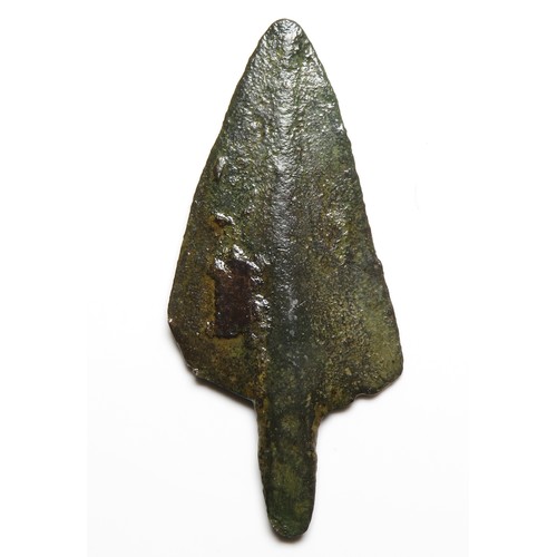 7 - Bronze age arrowhead c. 1250-800 BC. A mid to late Bronze age arrowhead of bevelled triangular form ... 