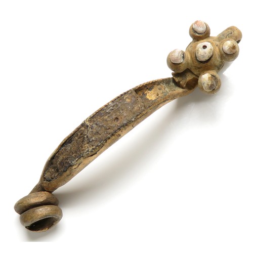 10 - La Tene I type brooch with coral inlay. An early la Tene type brooch with arched bow and returned fo... 