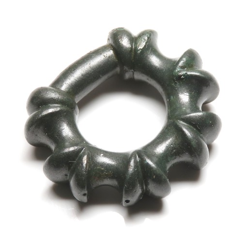 12 - Miniature terret ring. A very fine example of a late Iron age miniature lipped terret. The ring is o... 