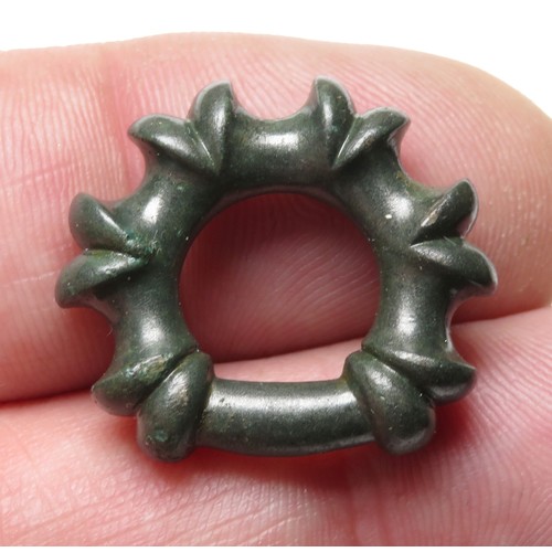 12 - Miniature terret ring. A very fine example of a late Iron age miniature lipped terret. The ring is o... 