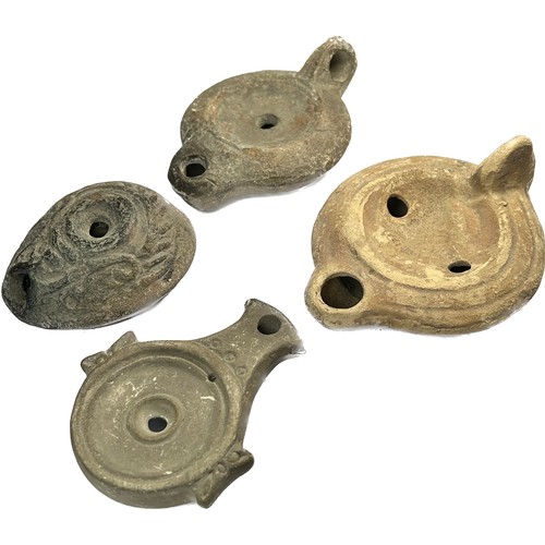 26 - Collection of Roman Pottery Oil Lamps. Circa 1st-5th century AD. 74 - 112 mm. Four lamps from variou... 